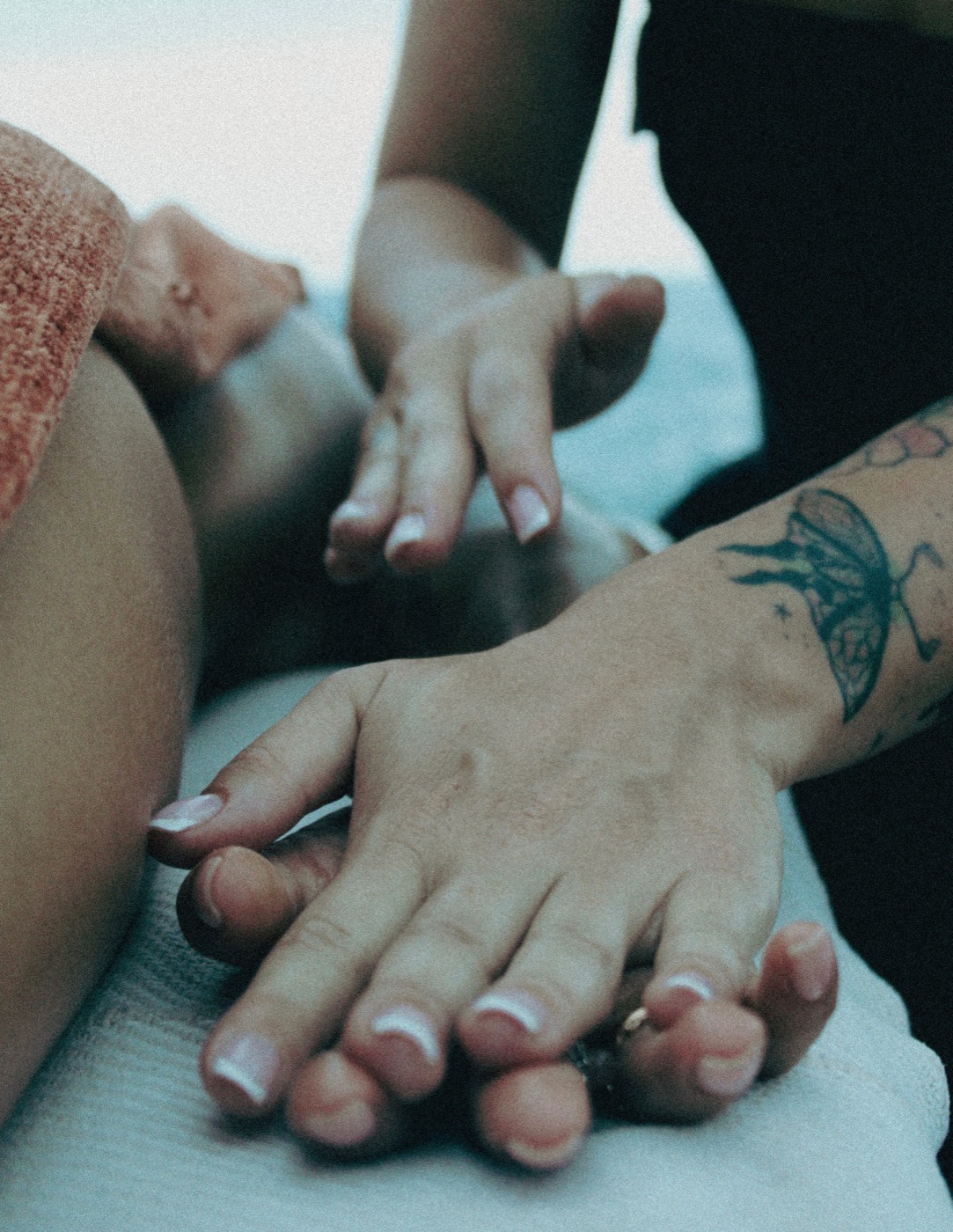 Close-up of Julie's hands during a massage
